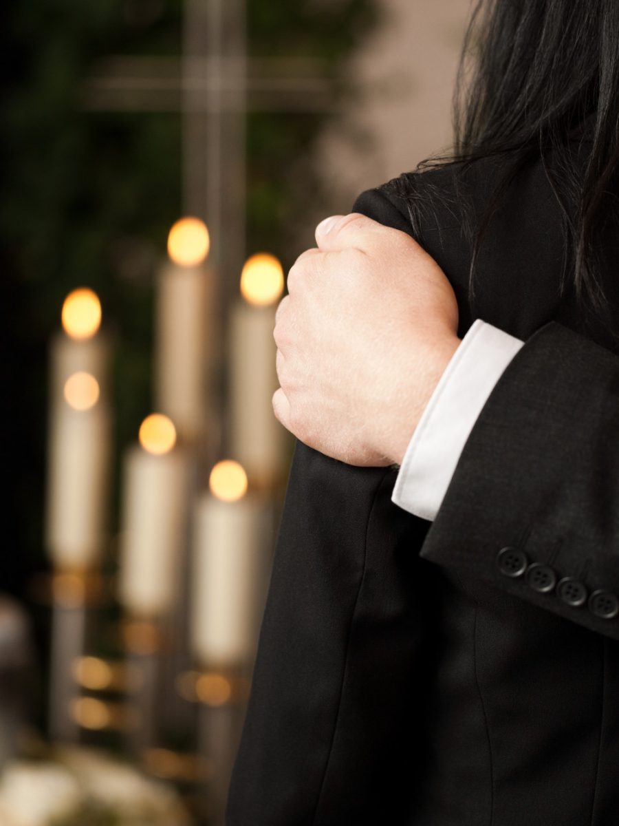 people-funeral-consoling-each-other people-funeral-consoling-each-other